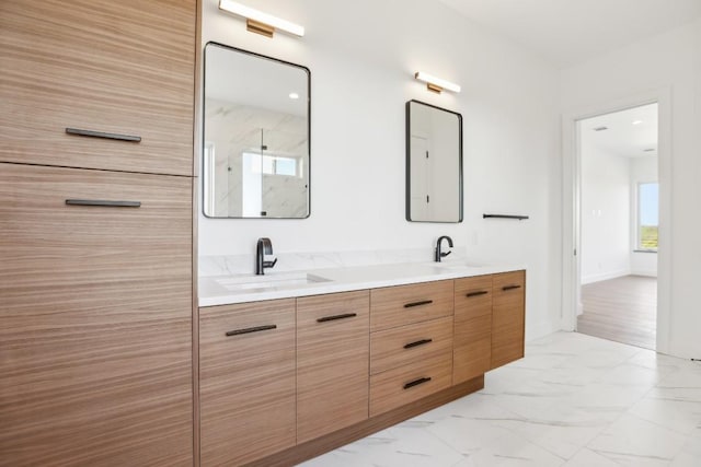 bathroom featuring a shower and vanity