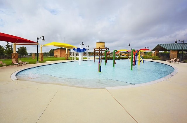 view of swimming pool featuring pool water feature