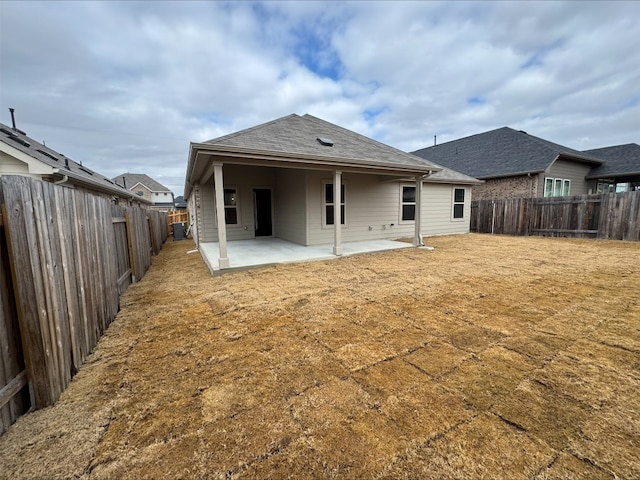 back of property with a patio area