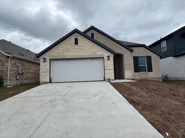 ranch-style house featuring a garage