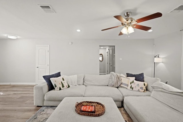 living area featuring ceiling fan, recessed lighting, visible vents, and light wood-type flooring