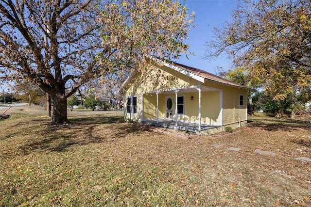 view of property exterior with a porch