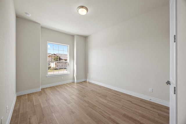 unfurnished room with light hardwood / wood-style floors