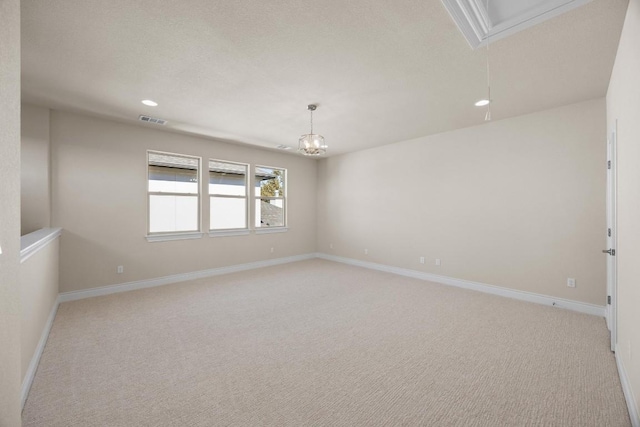 225 Skyflower Dr, Georgetown, TX 78628 - empty room with attic access, light colored carpet, recessed lighting, and a chandelier