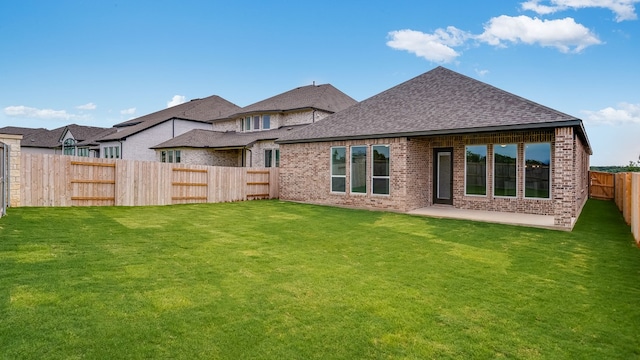 113 Golden Sage Ave, Georgetown, TX 78633 - rear view of property featuring brick siding, a shingled roof, a fenced backyard, and a patio