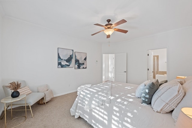 bedroom with a ceiling fan, baseboards, ornamental molding, carpet, and ensuite bath