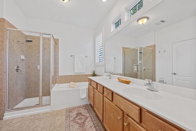 full bath with a garden tub, a sink, and a shower stall