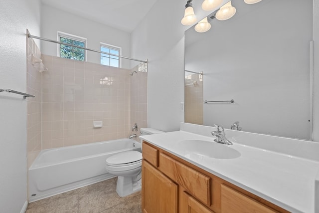 bathroom featuring  shower combination, vanity, toilet, and tile patterned floors