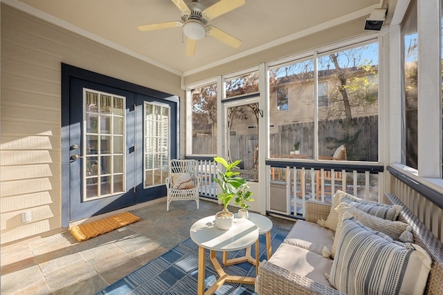 sunroom / solarium with ceiling fan