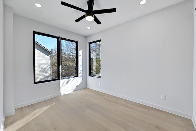 unfurnished room featuring light hardwood / wood-style flooring and ceiling fan