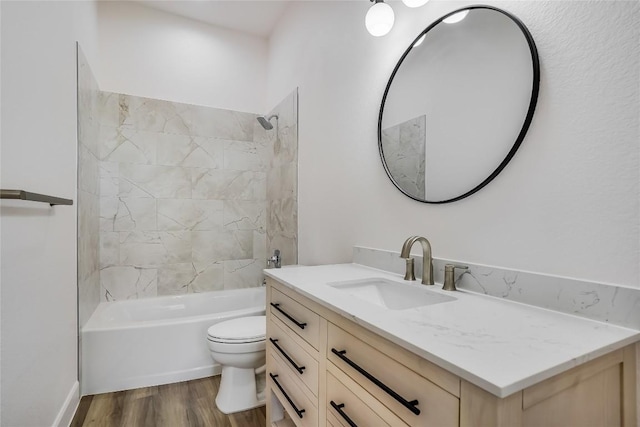 189 Mauna Kea Ln, Bastrop, TX 78602 - bathroom with vanity, toilet,  shower combination, and wood finished floors