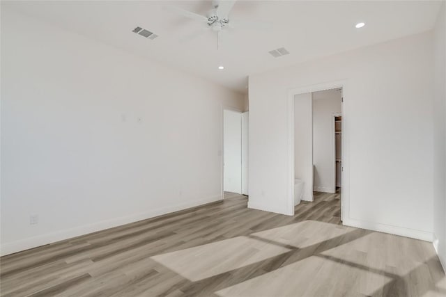 189 Mauna Kea Ln, Bastrop, TX 78602 - unfurnished bedroom featuring wood finished floors, baseboards, recessed lighting, and a ceiling fan