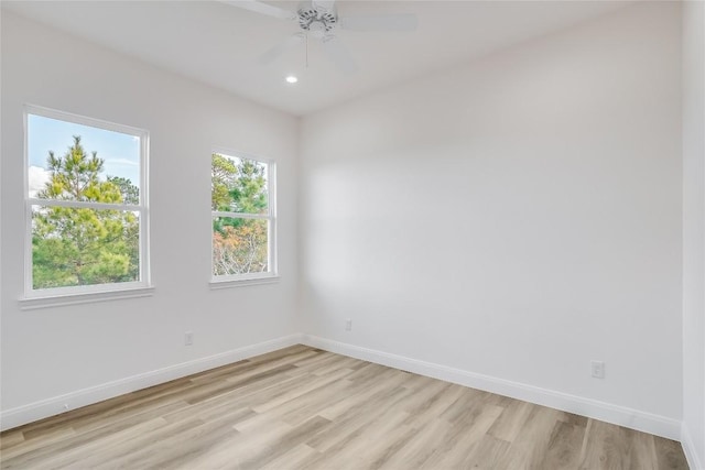 189 Mauna Kea Ln, Bastrop, TX 78602 - empty room with light wood finished floors, baseboards, ceiling fan, and recessed lighting