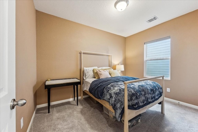 bedroom featuring carpet