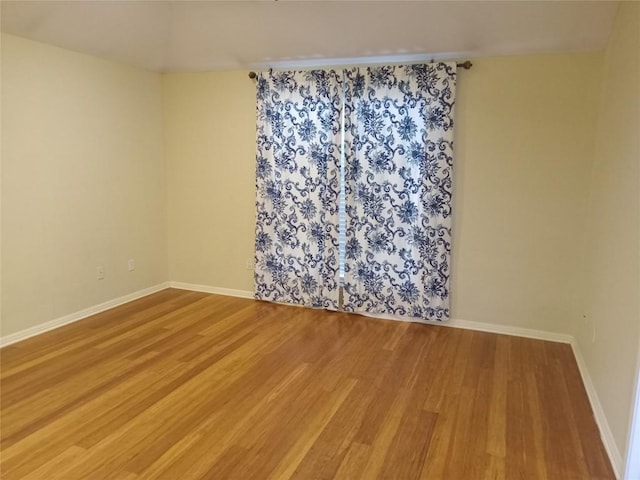 empty room featuring hardwood / wood-style flooring