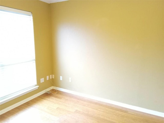 unfurnished room featuring light wood-type flooring