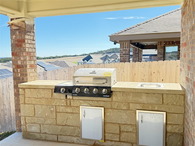 view of patio / terrace featuring an outdoor kitchen and grilling area