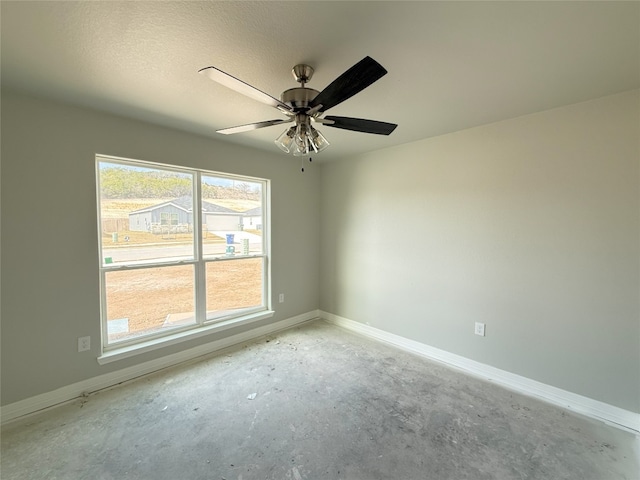 spare room with ceiling fan and a textured ceiling