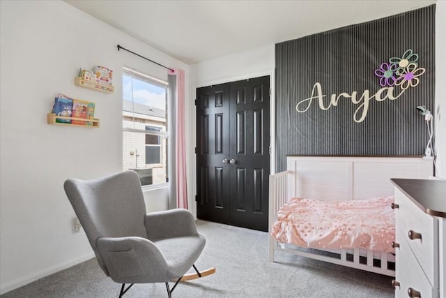 bedroom with carpet flooring and a closet