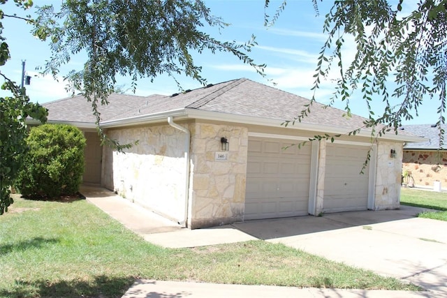 garage with a yard