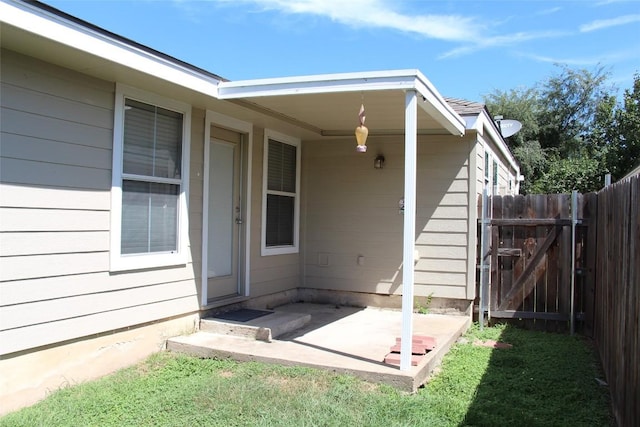 entrance to property with a patio