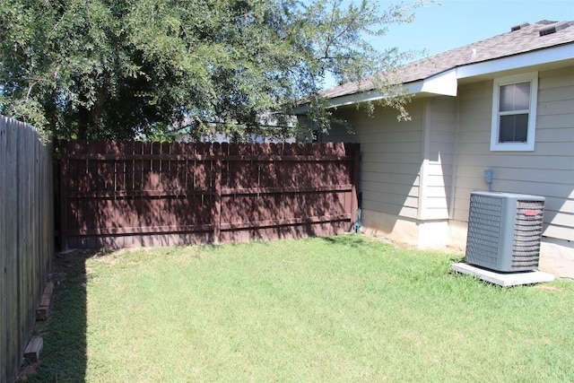 view of yard with central air condition unit