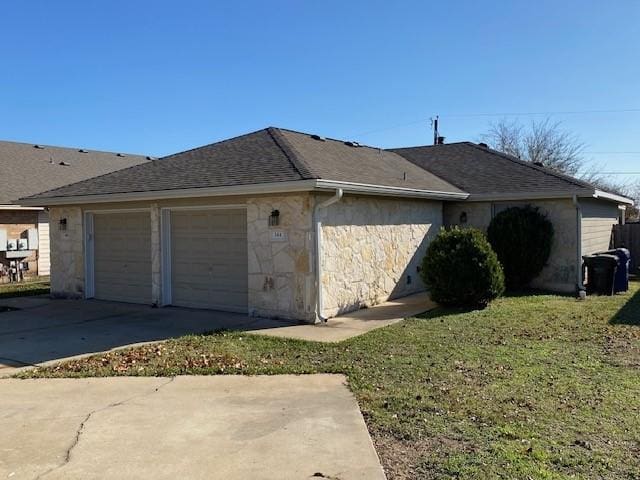 garage featuring a yard