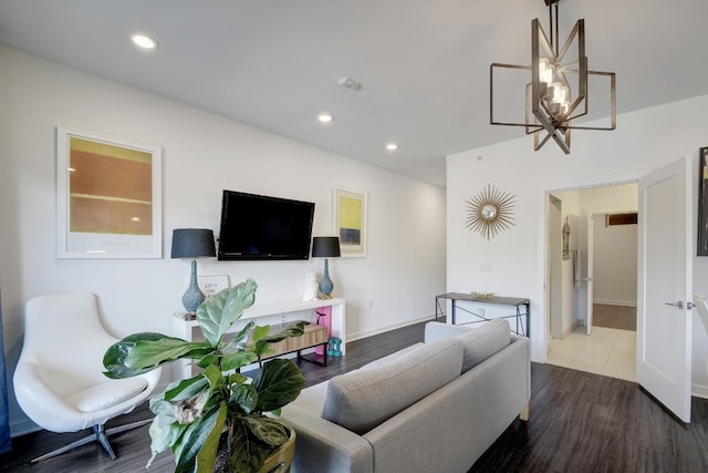 living room featuring hardwood / wood-style floors and a notable chandelier