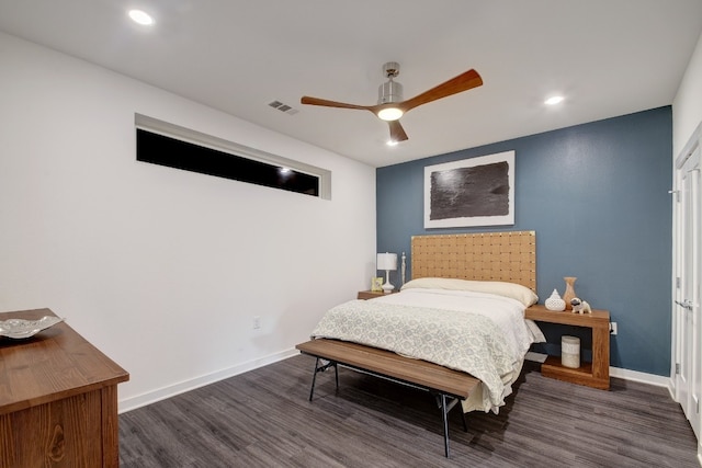 bedroom featuring ceiling fan and dark wood-type flooring