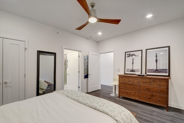 bedroom with ceiling fan and dark wood-type flooring