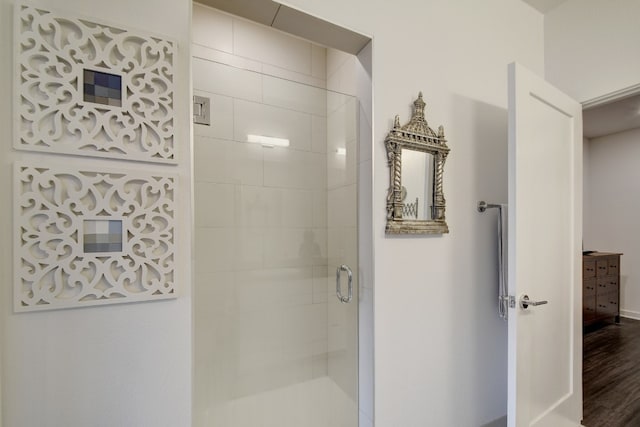 bathroom featuring wood-type flooring and walk in shower