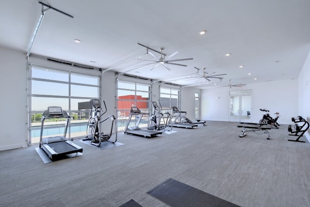 workout area featuring ceiling fan and carpet floors