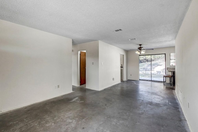 unfurnished room with a textured ceiling and ceiling fan