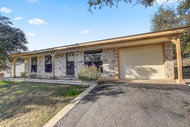 single story home with a garage