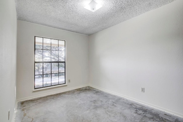 spare room featuring a textured ceiling