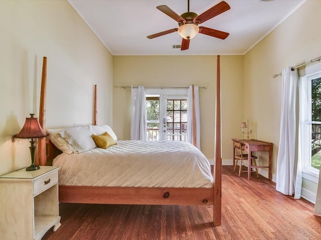 bedroom featuring ceiling fan, crown molding, and hardwood / wood-style flooring