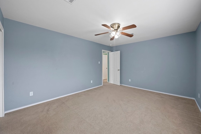 unfurnished bedroom with ceiling fan and light colored carpet