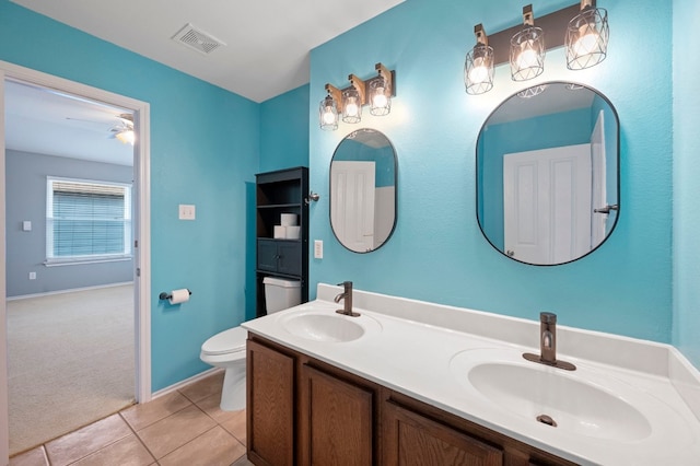 bathroom featuring vanity, toilet, and tile patterned floors