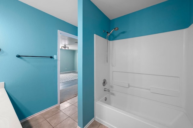 bathroom with vanity, bathing tub / shower combination, and tile patterned flooring