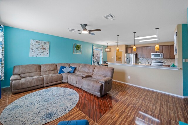 living room featuring ceiling fan