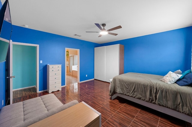 bedroom featuring connected bathroom and ceiling fan