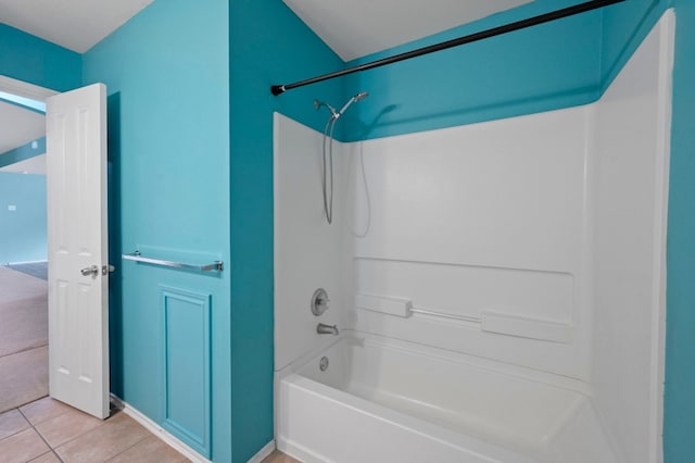 bathroom featuring tile patterned floors and bathing tub / shower combination