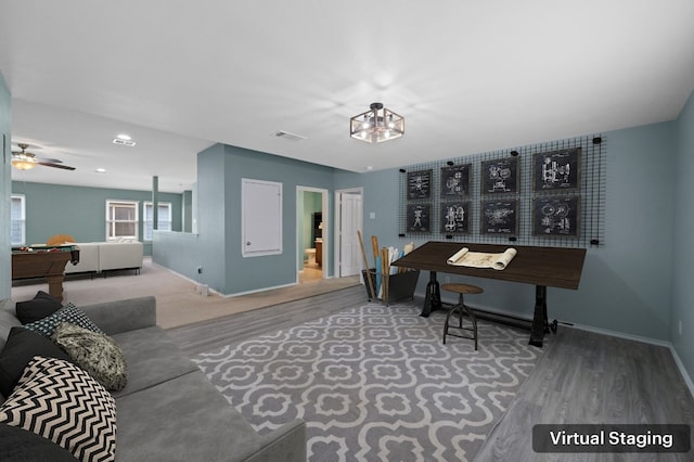 home office featuring wood-type flooring and ceiling fan