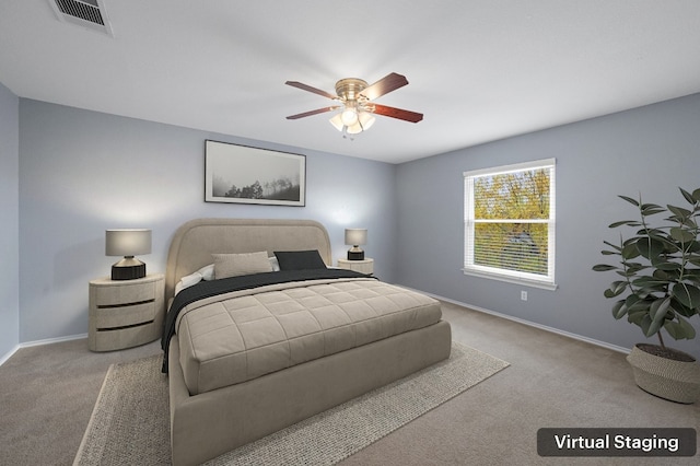 bedroom featuring ceiling fan and light carpet