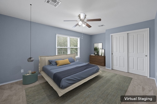 bedroom featuring a closet, ceiling fan, and carpet flooring