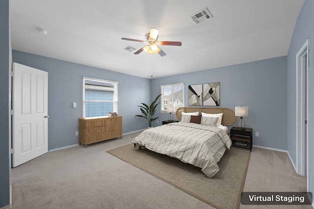 bedroom with ceiling fan and light colored carpet