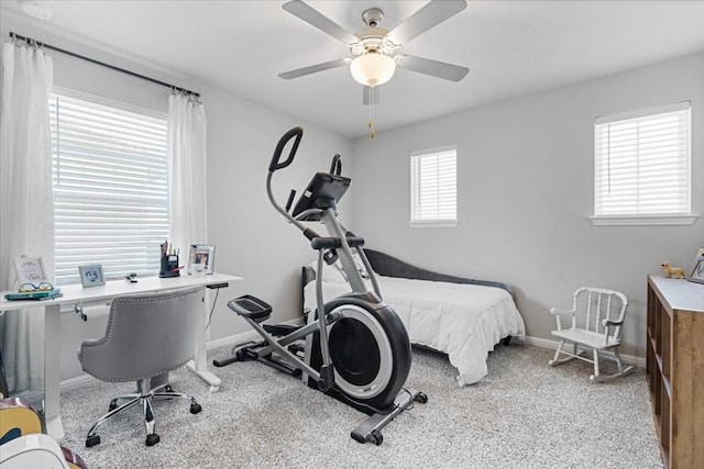 bedroom featuring multiple windows, ceiling fan, and light colored carpet