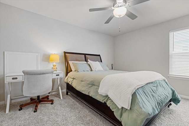 bedroom featuring ceiling fan and light carpet