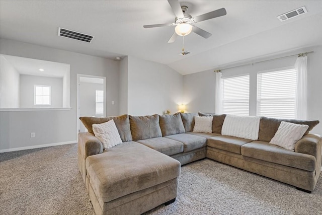 living room featuring ceiling fan, light colored carpet, and lofted ceiling