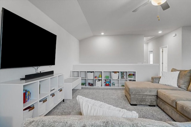 carpeted living room with ceiling fan and lofted ceiling